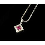 AN 18CT WHITE GOLD AND RUBY PENDANT NECKLACE Having an arrangement of rubies edged with diamonds, on