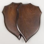 A PAIR OF ROWLAND WARD CARVED OAK REPLICA SHIELDS. Exceptional quality replicas of an original