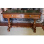 A VICTORIAN MAHOGANY WRITING TABLE With green tooled leather top above two drawers, raised on two
