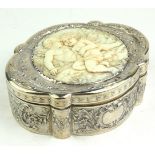 AN EARLY 20TH CENTURY GERMAN SILVER AND IVORY OVAL CASKET With embossed floral decoration, the lid