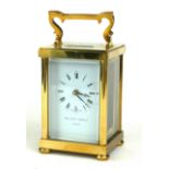 MATHEW NORMAN, A 20TH CENTURY GILT BRASS CARRIAGE CLOCK Having a single carry handle, visual