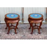 A PAIR OF CHINESE HARDWOOD PLANT STANDS The circular top inset with floral decorated cloisonné