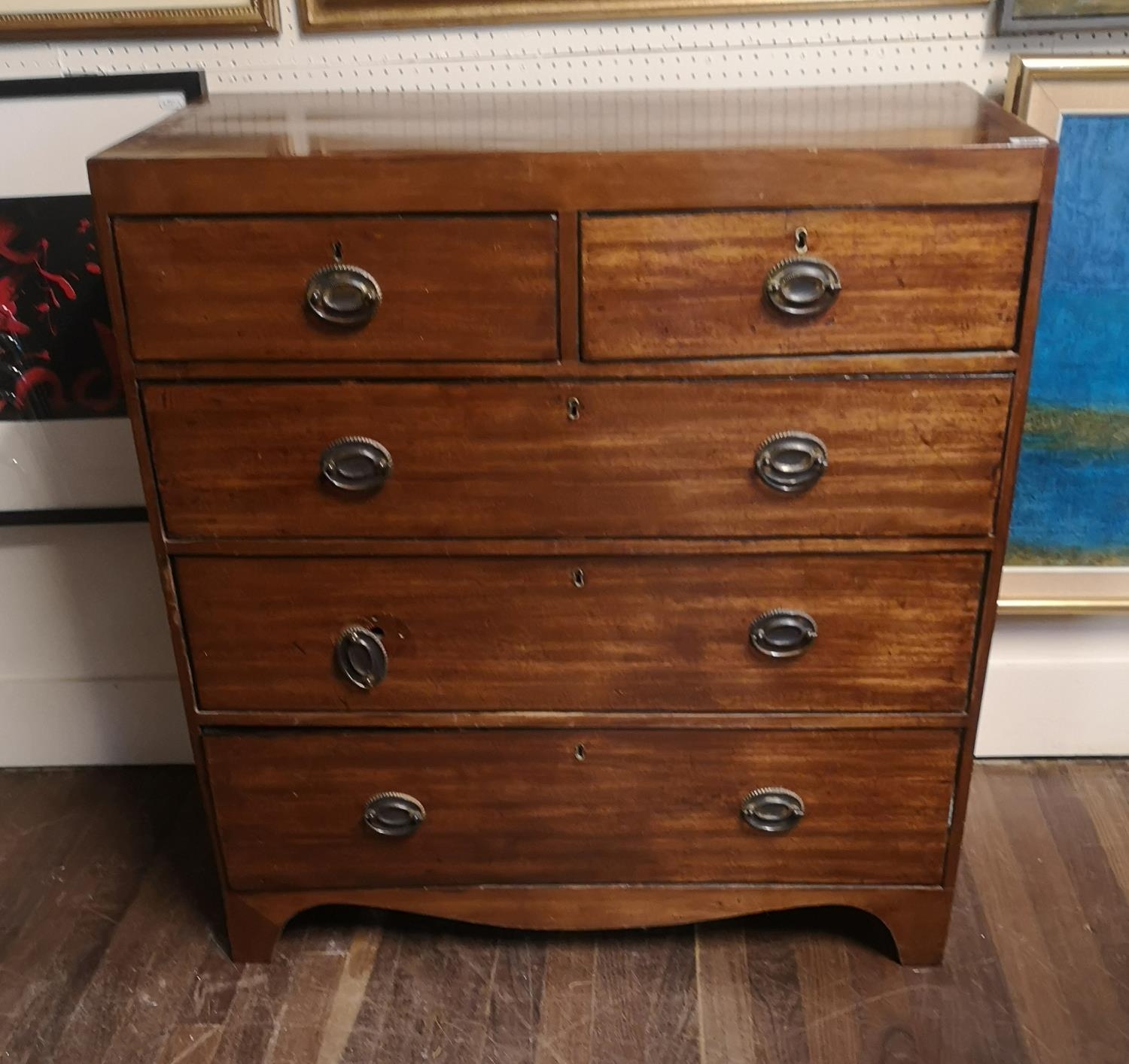 A GEORGIAN MAHOGANY CHEST OF TWO SHORT ABOVE THREE LONG DRAWERS On bracket feet. (90cm x 46cm x