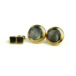 A PAIR OF 9CT GOLD AND MOTHER OF PEARL EARRINGS Each set with a circular disc mother of pearl in a