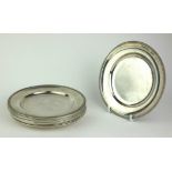 A SET OF A COLLECTION OF ELEVEN CONTINENTAL SILVER SIDE PLATES Plain form with gadrooned border,