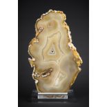 AN AGATE SLICE MOUNTED ON A CUSTOM ACRYLIC DISPLAY STAND, BRAZIL (h 32.5cm x w 19.5cm x d 6cm)