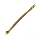 A VINTAGE 9CT GOLD CURB LINK BRACELET Having uniform pierced links and bar form clasp. (approx 20cm)