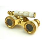 A PAIR OF GILT BRASS AND MOTHER OF PEARL OPERA GLASSES Having a telescopic handle. (approx 10cm)