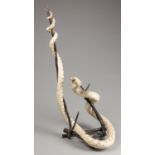 A LATE 19TH/EARLY 20TH CENTURY TAXIDERMY GLOSSY SNAKE UPON A NATURALISTIC BASE (h 76cm x w 48cm x