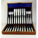 A SET OF VICTORIAN SILVER AND MOTHER OF PEARL FISH KNIVES AND FORKS Twelve place setting with