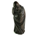 A CHINESE ROSEWOOD FIGURE OF A SCHOLAR WITH PEACH Standing pose with carved with elongated head,