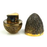 STUART DEVLIN, A SILVER GILT 'SURPRISE' EGG, with bark textured finish, opening to reveal a mouse
