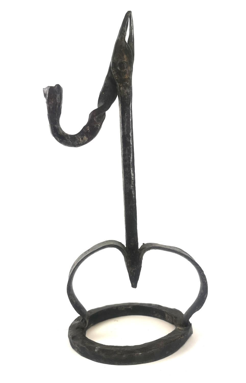 A SUBSTANTIAL ANTIQUE WROUGHT IRON RUSHLIGHT Square column, two splayed legs, on circular base. (
