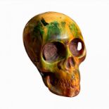 AN AMBER DESIGN SKULL PAPERWEIGHT With green, yellow and red resin. (approx 12cm x 10cm)