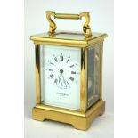 TAYLOR AND BLIGH, A LARGE 20TH CENTURY GILT BRASS CARRIAGE CLOCK Having a single carry handle,