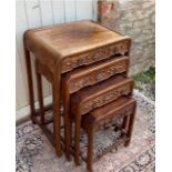 A SET OF FOUR EARLY 20TH CENTURY CHINESE HARDWOOD NESTING TABLES The square section tops over