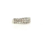 AN 18CT WHITE GOLD AND DIAMOND HALF ETERNITY RING The single row of eleven graduated marquise cut