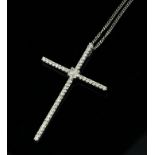 AN 18CT WHITE GOLD AND DIAMOND CRUCIFIX PENDANT Having an arrangement of round cut diamonds, on a