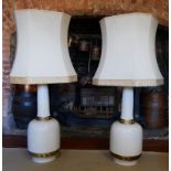 A PAIR OF LARGE CREAM AND GILT CERAMIC TABLE LAMPS Greek Key decoration, complete with shades. (