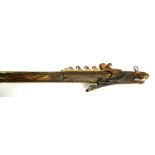 A POLYNESIAN CARVED BONE STAFF Carved with a dragon. (90cm) Condition: good