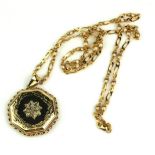 A 9CT GOLD AND DIAMOND OCTAGONAL PENDANT, LOCKET AND NECKLACE Having an arrangement of round cut