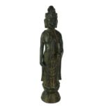 A BRONZE STATUE OF GUANYIN AND FLOWER Standing pose wearing long robes, on a double lotus base. (