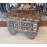 AN INDIAN BRASS AND SHEESHAM WOOD DOMED TOPPED CHEST ON WHEELS. (40cm x 53cm x 41cm) Condition: good