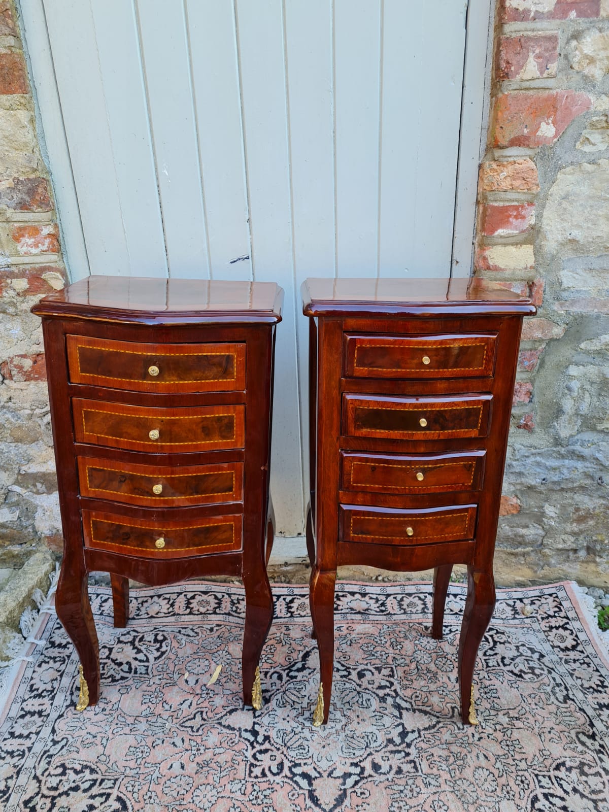 A PAIR OF CONTINENTAL LACQUERED WALNUT BOW FRONTED PEDESTAL CHESTS With four drawers, on cabriole