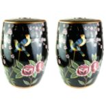 A PAIR OF 20TH CENTURY FAMILLE NOIR STYLE PORCELAIN GARDEN BARREL SEATS Painted with birds and