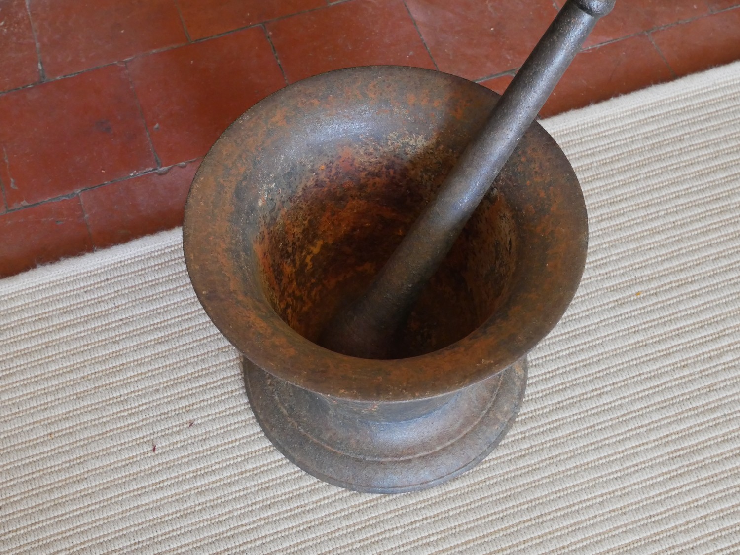 A LARGE 19TH CENTURY CAST IRON PESTLE AND MORTAR Classical bell form, on a circular base. (approx - Image 2 of 2