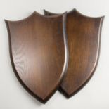 A LARGE PAIR OF PETER SPICER & SONS CARVED OAK REPLICA SHIELDS. Exceptional quality replicas of an