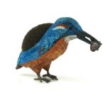 A COLD PAINTED METAL KINGFISHER With fish to beak and velvet cushion to back. (approx 14cm x 7cm)