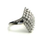 AN 18CT WHITE GOLD AND DIAMOND RING The arrangement of pavé set diamonds in a lozenge form design (