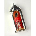 A SILVER AND ENAMEL 'SOLDIER SENTRY' NOVELTY VESTA CASE Set with oval enamel panel to front and