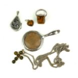 A COLLECTION OF CONTINENTAL WHITE METAL AND AMBER JEWELLERY Comprising a cross pendant necklace,