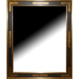 A BEVELLED PLATE OVER MANTLE MIRROR In a parcel gilt and brown frame. (103cm x 123cm) Condition: