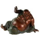 A LARGE BRONZE MODEL OF A BUDDHA IN HAPPY MEDITATION TECHNIQUE. (length 63cm x h 39cm)