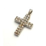 AN 18CT WHITE GOLD AND DIAMOND CROSS PENDANT Having two rows of round cut diamonds and a fine link