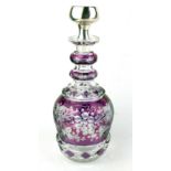 A CONTINENTAL SILVER AND BOHEMIAN GLASS DECANTER The circular stopper bearing an engraved monogram