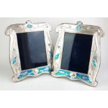 A LARGE PAIR OF CONTINENTAL SILVER AND ENAMEL ART NOUVEAU DESIGN PHOTOGRAPH FRAMES Decorated with
