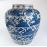 A LARGE CHINESE BLUE AND WHITE OVOID POTTERY VASE Decorated with multi deer with stylised rocks,