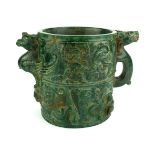 AN ORIENTAL GREEN GLAZED JADE BRUSH POT Carved with human figure and mythological animals. (diameter