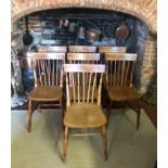 A SET OF SEVEN LATE 19TH CENTURY ASH AND ELM STICK BACK CHAIRS Having solid seats, on turned legs