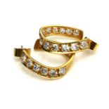 A PAIR OF 18CT GOLD AND DIAMOND HOOP EARRINGS The arrangement of round cut diamonds forming a