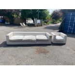 A LARGE CONTEMPORARY CREAM VELVET UPHOLSTERED THREE SEATER SETTEE, along with matching armchair