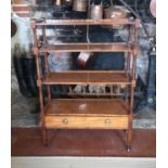 A 19TH CENTURY SATINWOOD FLOORSTANDING OPEN BOOKCASE With graduating shelves and lower drawer,