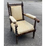 A LATE VICTORIAN MAHOGANY OPEN ARMCHAIR With barley twist supports, upholstered back seat arms,