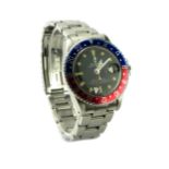 ROLEX, GMT-MASTER, A STAINLESS STEEL GENT'S WRISTWATCH Having a black tone dial, Mercedes hands