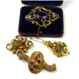 A COLLECTION OF THREE VICTORIAN YELLOW METAL AND GEM SET BROOCHES Each set with an oval cut
