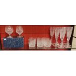 A COLLECTION OF STUART CUT LEAD CRYSTAL DRINKING GLASSES A set of eight champagne flutes with cut